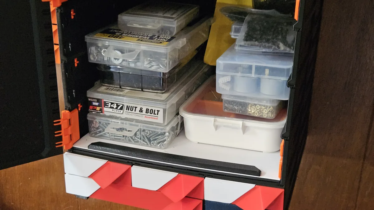 A loaded open shelf in a build, the black shelf lip along its front edge