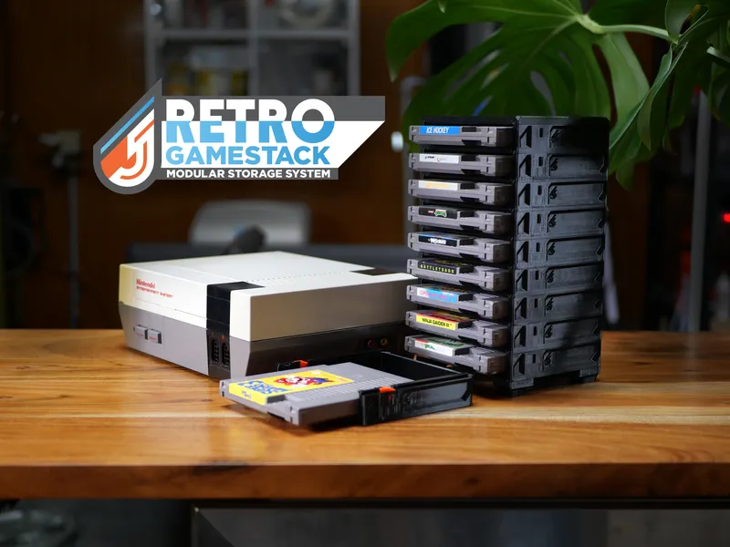 GameStack tower holding NES cartridges beside an NES console, one cartridge tray slid open