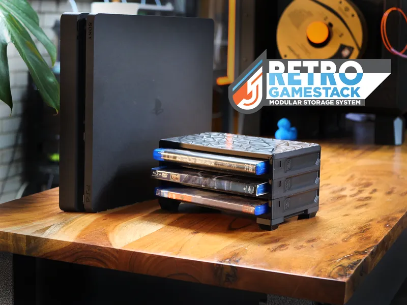 GameStack trays holding PS4 and Blu-ray cases next to a PlayStation console