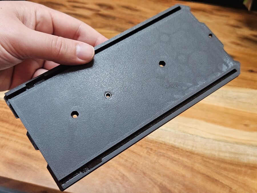 The Size Adapter Cover with its nut slots