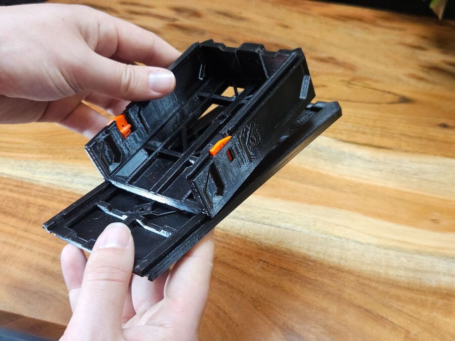 Sliding the shorter case onto the Size Adapter Cover's rails