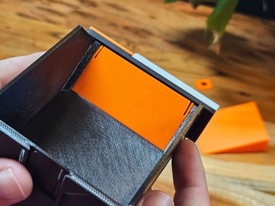 The cover snapped into place across the bin front, seen from inside